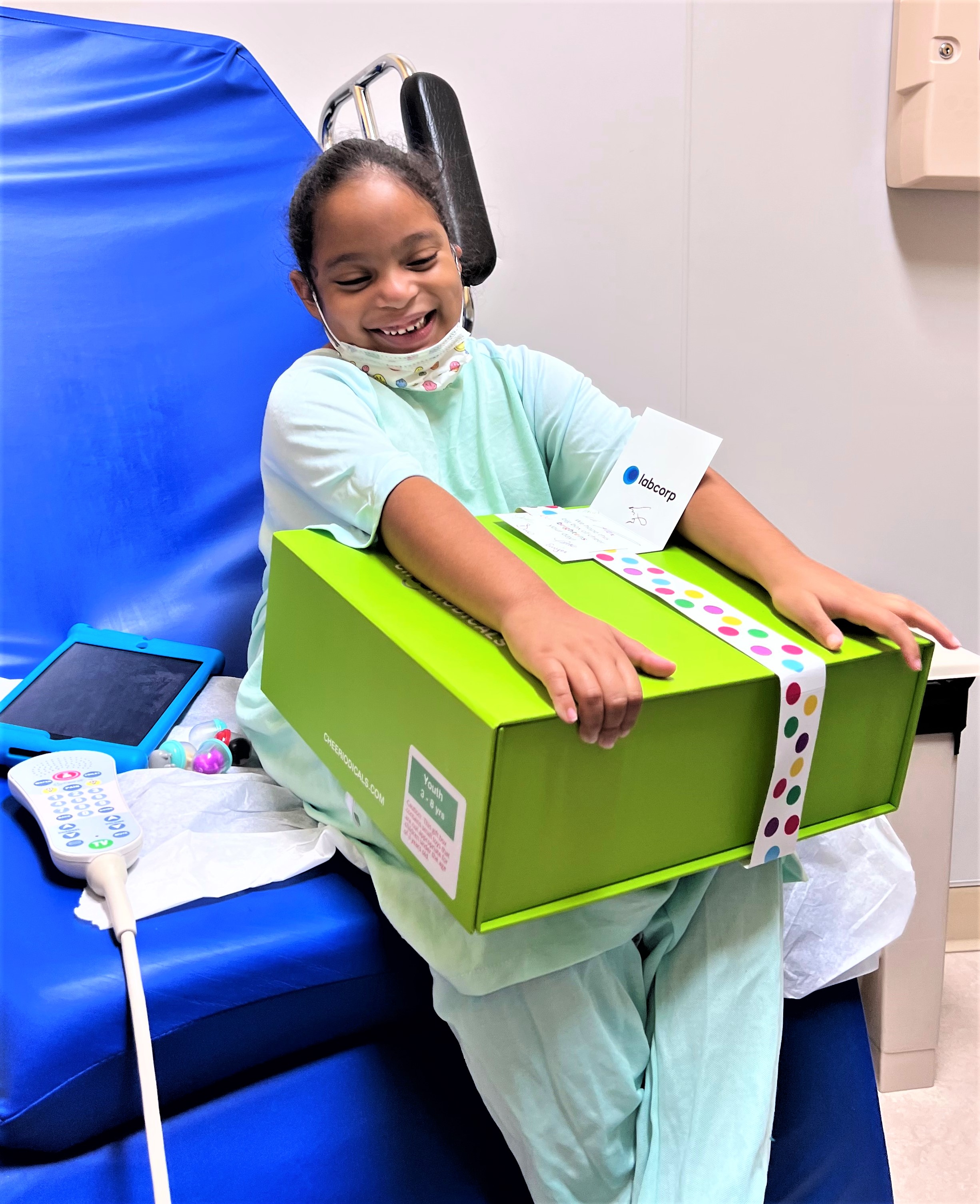 Girl in hospital with Cheeriodicals frog and box
